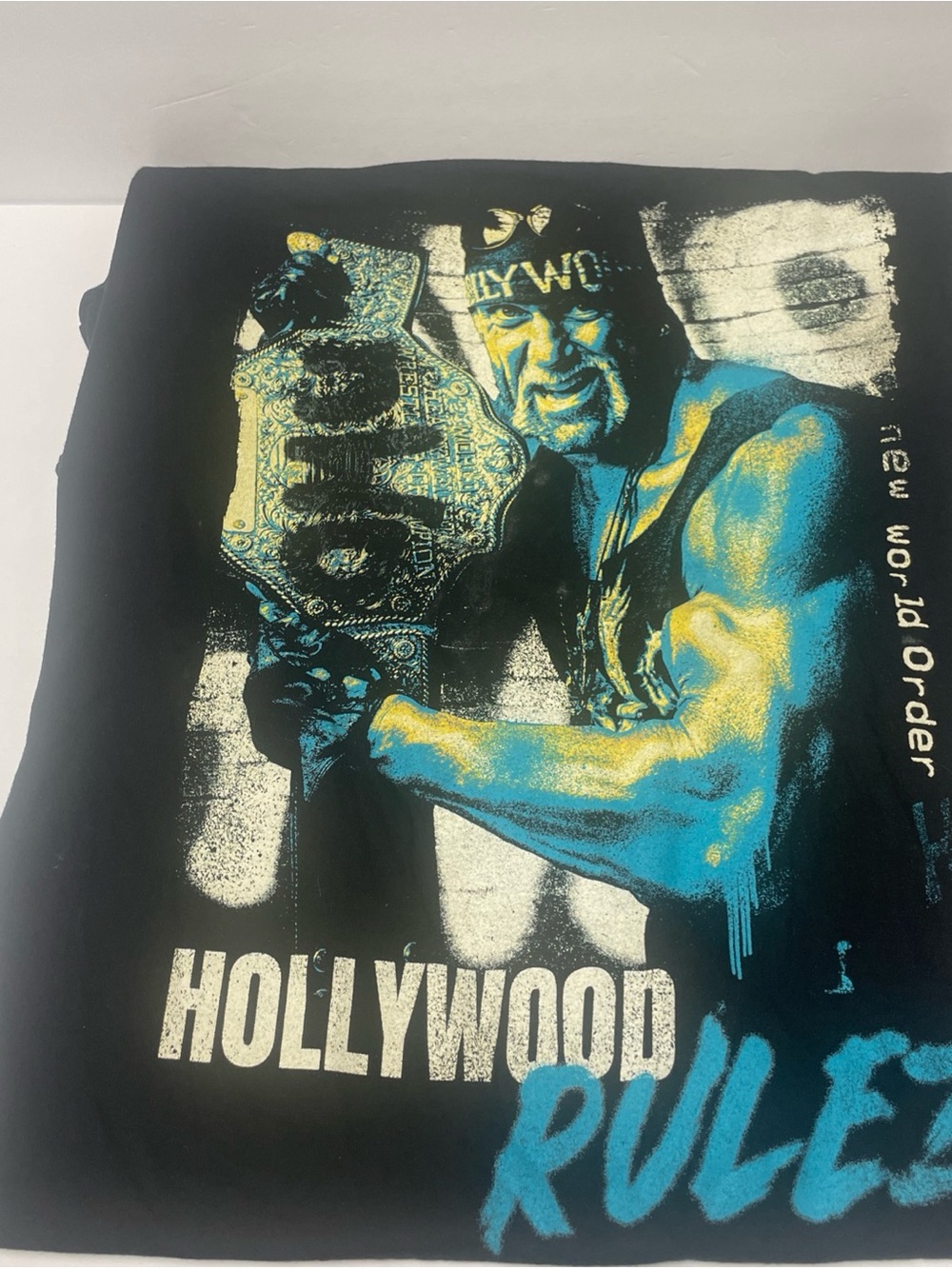 WWE Black Graphic Tee with Blue and Gold Hollywood Design